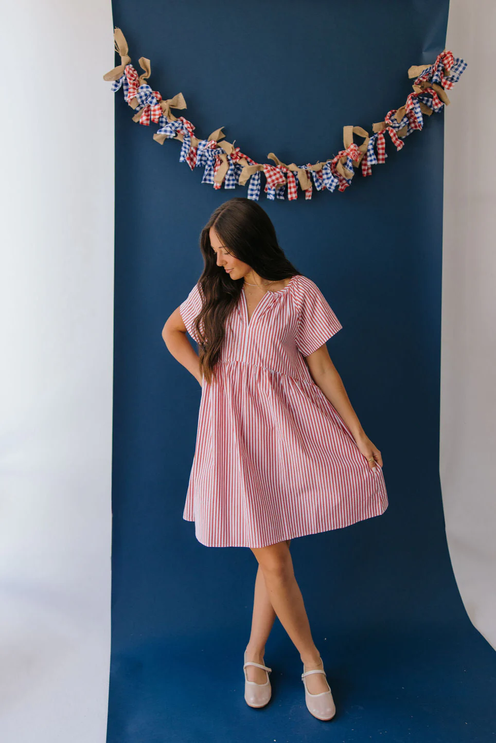 THE ABBY STRIPED BABYDOLL DRESS IN WHITE