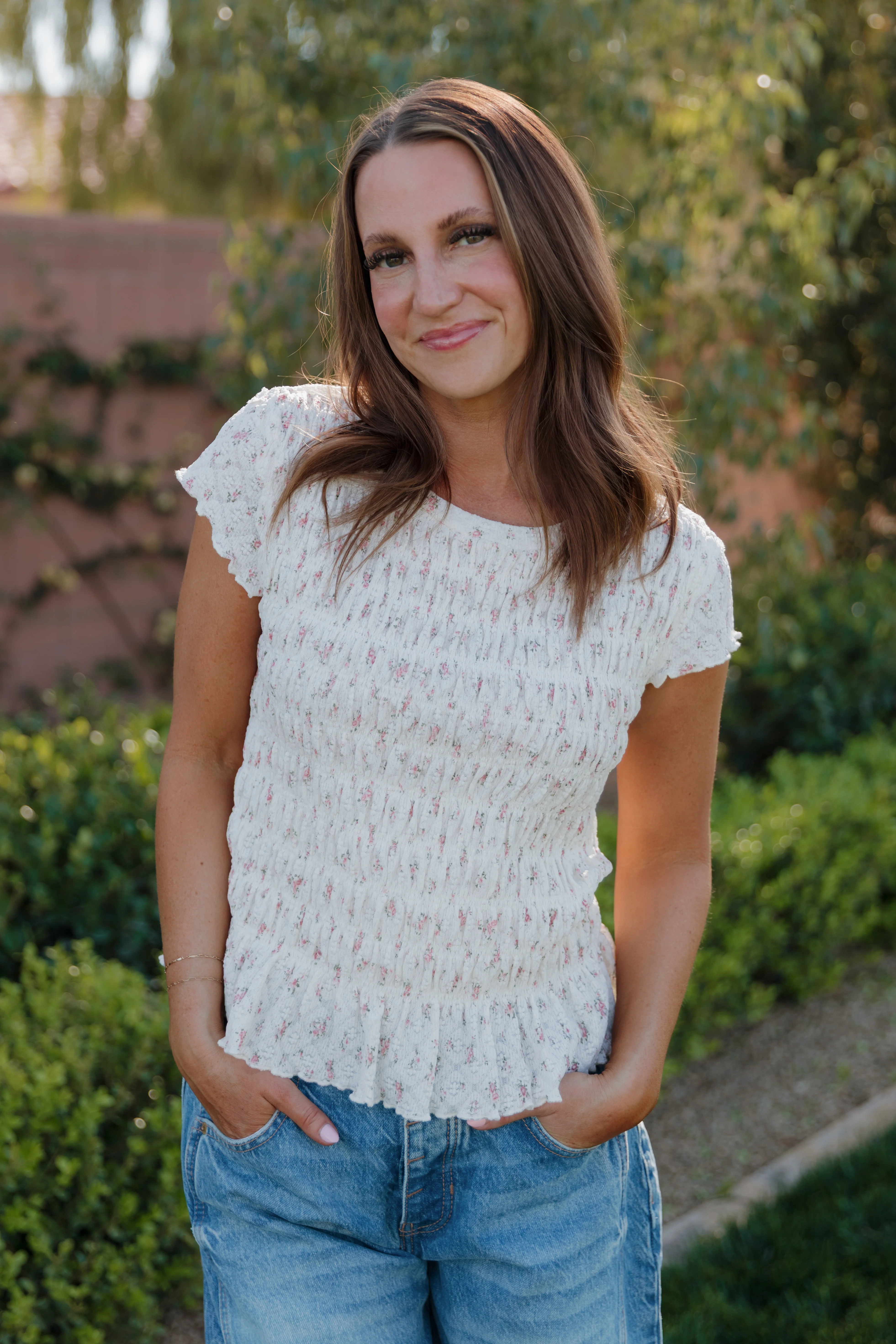 THE MADISON SMOCKED FLORAL TOP IN CREAM
