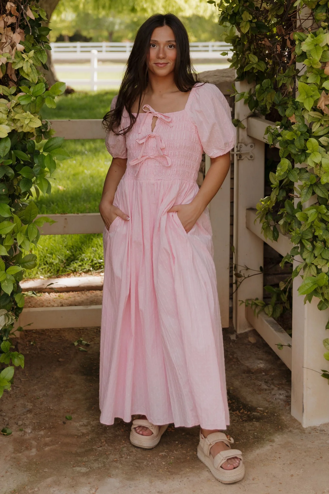 THE SUZANNAH BOW DETAIL DRESS IN PINK